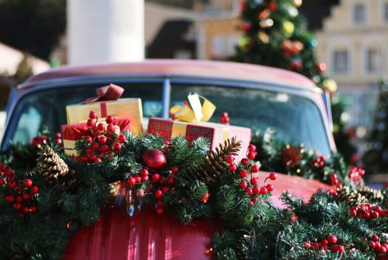 green and red wreath on red car